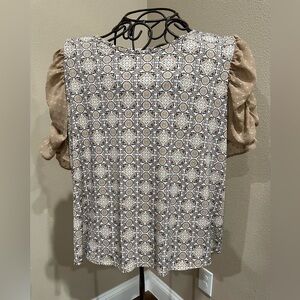 Cato blouse with navy/tan/white print and tan, sheer ruched sleeves